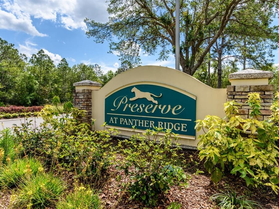 The Preserve at Panther Ridge entrance sign surrounded by trees and landscaping