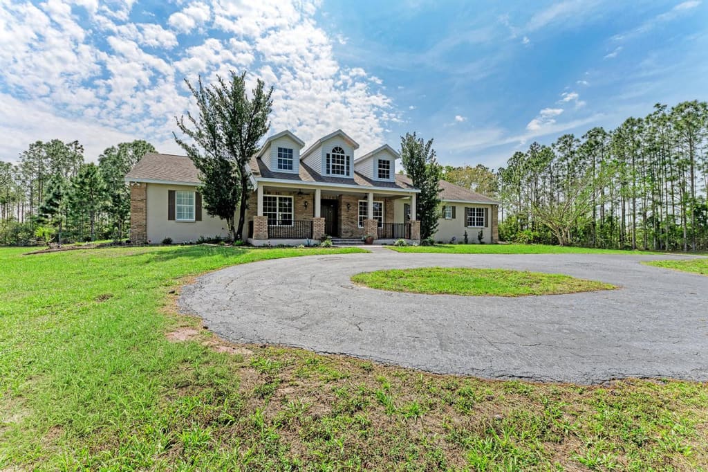 Front exterior and circular driveway at 21616 67th Ave E in Panther Ridge
